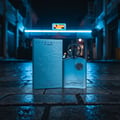 Supremacy In Heaven on old street stone at Pasar Seni Kuala Lumpur, blue neon reflection, artistic masculine cinematic mood.
