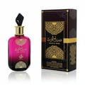 Perfume bottle and packaging with intricate design on a white background