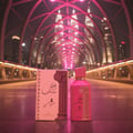 Ard Al Zaafaran Ahubbak Love In Paris EDP 100ml Zaafaran — Pink perfume bottle with a decorative column motif and gold accents, featuring Arabic script and "Love in Paris" text.