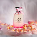 Hareem Al Sultan 100 ml EDP – Perfume bottle with pink ribbon on a soft, blurred background