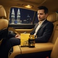 lelaki tengok wild one gold atas kerusi belakang kereta malam kl