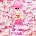 Fubbees Dreamy Treats perfume bottle on a bed of pink marshmallows with flavor notes text.