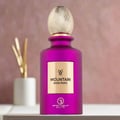 Purple perfume bottle with gold cap on a blurred background