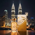 Afkaar dengan latar KLCC malam, cahaya keemasan elegan