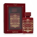 Red perfume bottle with gold designs and matching packaging on a white background