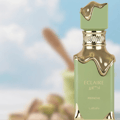Two Eclaire Pistache & Banoffi perfume bottles with a blurred dessert and banana background.