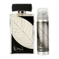 Two perfume bottles with leaf design labels on a white background