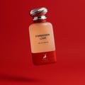 Perfume bottle labeled 'Forbidden Love' on a red background