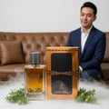 Your Touch Intense on polished marble with juniper and icy mist, Malaysian interior clear bottle and box, cinematic realism.