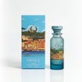 OSMA bottle and packaging with a scenic background of water and boats