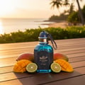 Unisex perfume bottle on teak deck at tropical coastline golden hour with mango and bergamot – Al Barari Coral Malaysia