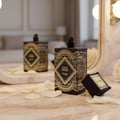 Happy Oud by Zimaya perfume bottle in mirror reflection with petals elegant unisex scent Malaysia