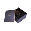 Open box containing a black perfume bottle labeled 'zimoya' on a white background