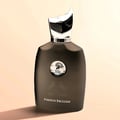 Maison Alhambra Perseus Exclusif — A dark grey perfume bottle with a silver cap and a circular emblem on the front, next to its matching black box with silver horse and deer graphics. | Maison Alhambra Perseus Exclusif — Botol minyak wangi kelabu gelap dengan penutup perak dan lambang bulat di hadapan, bersebelahan