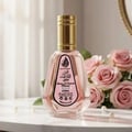Ard Al Zaafaran Pink Blush Shams Al Emarat Khususi 50ml Perfume — Pink glass perfume bottle with gold spray nozzle and cap, label shows Arabic script and English text, isolated on white background.