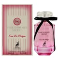 Maison Alhambra Pink Shimmer Secret 100ml — Pink perfume bottle with a black ribbon bow, next to its matching pink striped box, on a white background. | Maison Alhambra Pink Shimmer Secret 100ml — Botol minyak wangi merah jambu dengan reben hitam, bersebelahan kotak berjalur merah jambu yang sepadan, di atas latar