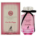Maison Alhambra Pink Shimmer Secret 100ml — Pink perfume bottle with a black ribbon bow, next to its matching pink striped box, on a white background. | Maison Alhambra Pink Shimmer Secret 100ml — Botol minyak wangi merah jambu dengan reben hitam, bersebelahan kotak berjalur merah jambu yang sepadan, di atas latar