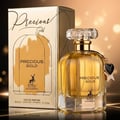 Maison Alhambra Precious Gold 80ml by Maison Alhambra — A gold-themed perfume box and bottle are displayed side-by-side against a white background. The box features abstract gold brushstrokes and a deer silhouette, while the bottle contains golden liquid and has a heart-shaped charm. | Maison Alhambra Precious Gold
