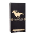 Ard Al Zaafaran Qaed Al Fursan — A gold-capped glass perfume bottle with amber liquid sits next to its black and gold box featuring a running horse graphic. | Ard Al Zaafaran Qaed Al Fursan — Botol kaca bertutup emas dengan cecair berwarna ambar duduk bersebelahan dengan kotak hitam dan emasnya yang menampilkan grafik