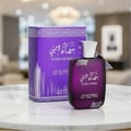 Ard Al Zaafaran Sama Dubai 100ml — A purple perfume bottle and its matching box are displayed against a white background. The box is decorated with intricate purple patterns and Arabic script. | Ard Al Zaafaran Sama Dubai 100ml — Sebotol minyak wangi ungu dan kotak padanannya dipaparkan berlatarkan putih. Kotak itu