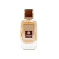 Ard Al Zaafaran Shahrazad Eau De Parfum — A white box with gold leaf pattern and a clear glass perfume bottle with gold accents and amber liquid, set against a white background. | Ard Al Zaafaran Shahrazad Eau De Parfum — Kotak putih dengan corak daun emas dan botol minyak wangi kaca jernih dengan aksen emas dan