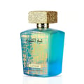 Lattafa Sheikh Al Shuyukh Supreme by Lattafa 100ml — A blue and green faceted glass perfume bottle with a gold textured cap sits next to its blue and light blue patterned box, which features an image of a man in traditional headwear. | Lattafa Sheikh Al Shuyukh Supreme by Lattafa 100ml — Botol kaca berfaset biru dan