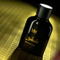 Gulf Orchid Shumookh Parfum 100ml Gulf Orchid — Black perfume bottle and its black and white patterned box with gold crown and Arabic text | Gulf Orchid Shumookh Parfum 100ml Gulf Orchid — Botol minyak wangi hitam dan kotaknya yang bercorak hitam putih dengan mahkota emas dan teks Arab