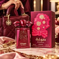 Asdaaf Sougha — Red perfume bottle with gold speckles and ornate floral embossed box with a red bow