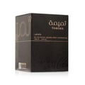Lattafa Tamima — Black perfume bottle with gold label and black cap, next to a black product box with gold Arabic script and text | Lattafa Tamima — Botol minyak wangi hitam dengan label emas dan penutup hitam, bersebelahan kotak produk hitam dengan skrip Arab emas dan teks