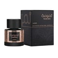 Lattafa Tamima — Black perfume bottle with gold label and black cap, next to a black product box with gold Arabic script and text | Lattafa Tamima — Botol minyak wangi hitam dengan label emas dan penutup hitam, bersebelahan kotak produk hitam dengan skrip Arab emas dan teks
