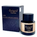 Lattafa Tamima — Black perfume bottle with gold label and black cap, next to a black product box with gold Arabic script and text | Lattafa Tamima — Botol minyak wangi hitam dengan label emas dan penutup hitam, bersebelahan kotak produk hitam dengan skrip Arab emas dan teks