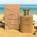 Paris Corner Taskeen Caramel Cascade 100ml — A rectangular perfume box with a marble-like pattern in beige and pink hues, accented with gold glitter stripes and gold text. | Paris Corner Taskeen Caramel Cascade 100ml — Peti minyak wangi berbentuk segi empat dengan corak seperti marmar dalam warna beige dan merah