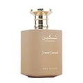 Paris Corner Taskeen Caramel Cascade 100ml — A rectangular perfume box with a marble-like pattern in beige and pink hues, accented with gold glitter stripes and gold text. | Paris Corner Taskeen Caramel Cascade 100ml — Peti minyak wangi berbentuk segi empat dengan corak seperti marmar dalam warna beige dan merah