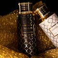 Maison Asrar Treasure by Maison Asrar 100ml EDP Unisex — Black bottle with gold geometric pattern and gold ornate cap, featuring a gold label with 'TREASURE ROYAL COLLECTION' text.