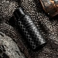 Maison Asrar Vanguard by Maison Asrar 100ml EDP Unisex — Black bottle with white geometric pattern and a white label with 'VANGUARD' and 'ROYAL COLLECTION' text.