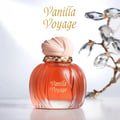 Maison Asrar Vanilla Voyage — Amber glass perfume bottle with a textured peach cap and gold trim, next to its peach box with a perfume silhouette.