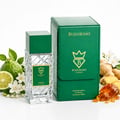 Bujairami Vibration by Bujairami 100ml Extrait de Parfum — Clear glass bottle with green cap and label next to a green