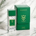 Bujairami Vibration by Bujairami 100ml Extrait de Parfum — Clear glass bottle with green cap and label next to a green