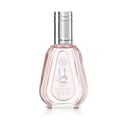 Ard Al Zaafaran Yara Eau De Parfum 50ml — Pink floral patterned box next to a faceted pale pink perfume bottle with a silver cap. | Ard Al Zaafaran Yara Eau De Parfum 50ml — Kotak bercorak bunga merah jambu di sebelah botol minyak wangi merah jambu pucat berfaset dengan penutup perak.