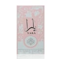 Ard Al Zaafaran Yara Eau De Parfum 50ml — Pink floral patterned box next to a faceted pale pink perfume bottle with a silver cap. | Ard Al Zaafaran Yara Eau De Parfum 50ml — Kotak bercorak bunga merah jambu di sebelah botol minyak wangi merah jambu pucat berfaset dengan penutup perak.